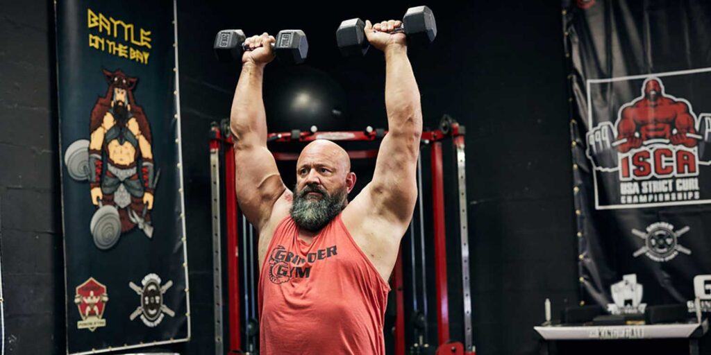 Dumbbell Standing Overhead Shoulder Press Dave 0212 1024x512