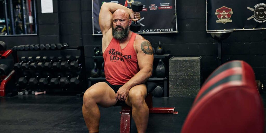 DB Single Arm Overhead Triceps Extensions 1 Dave 1500x750 1 1024x512
